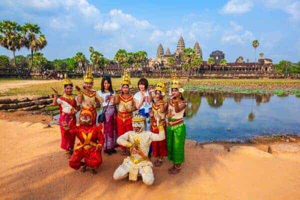 Artists in Khmer costume posing in front of Angkor Wat. Stock photo from Shutterstock / saiko3p